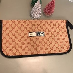 GUCCI- GG canvas Gucci MLB slipper pouch with grosgrain trim.